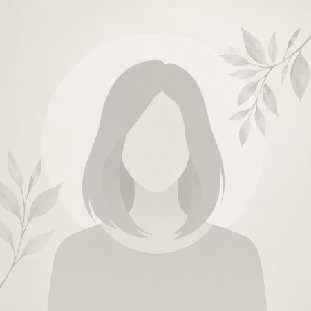 Abstract minimalist portrait: gray silhouette of a person with a circular halo and leafy branches for decoration.